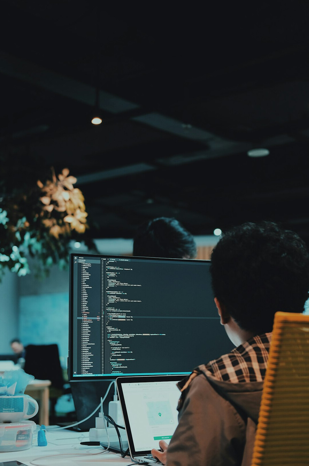 person reviewing code on screen