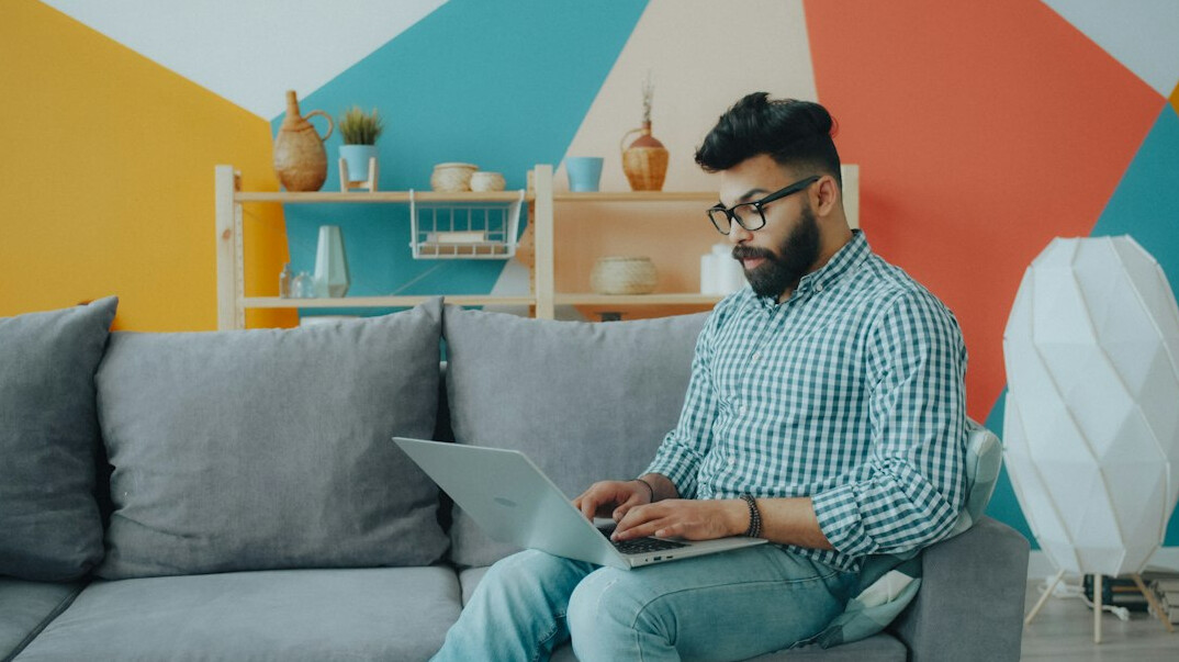 man coding at home