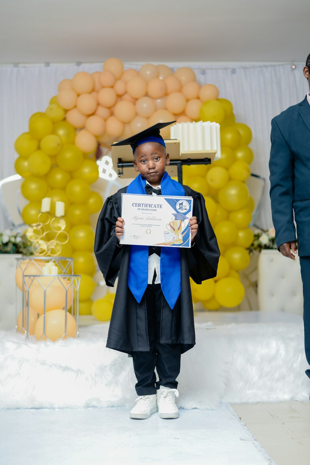 successful graduate holding certificate